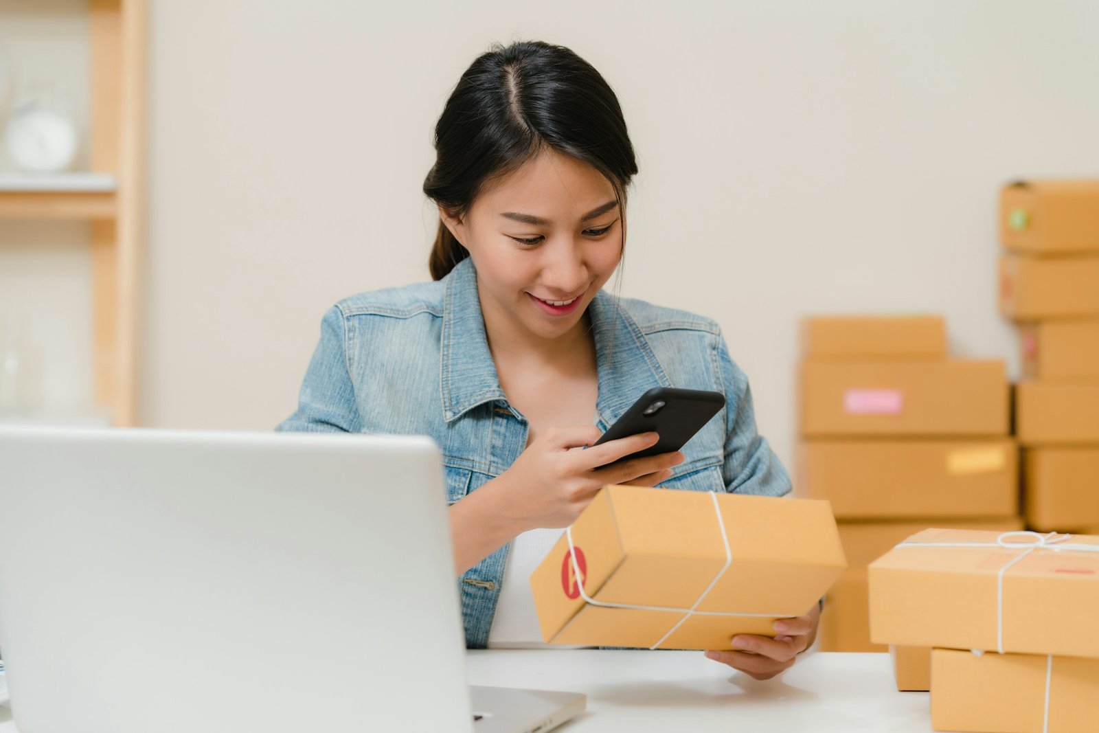 Entrepreneur managing products and inventory in a small business workspace